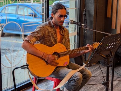 A picture of someone playing a guitar